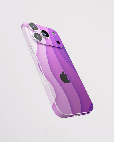 Skin premium para iPhone con diseño Flux Myst, vista lateral flotante y acabado mate